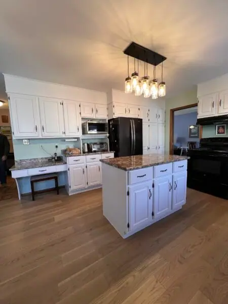 Professional cabinet painting service in Winnipeg showcasing a sleek finish.